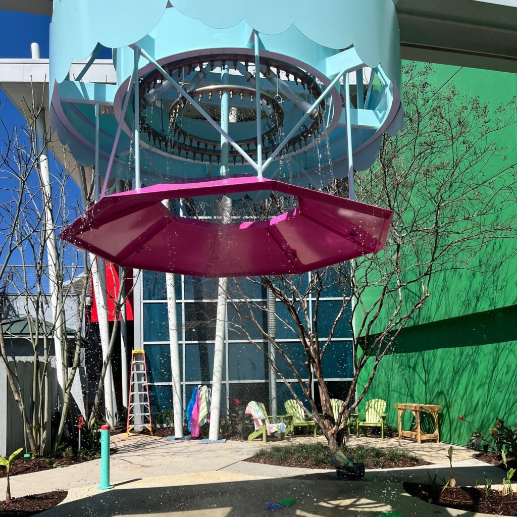 A large umbrella that works as a rain storm water feature at the literacy garden.