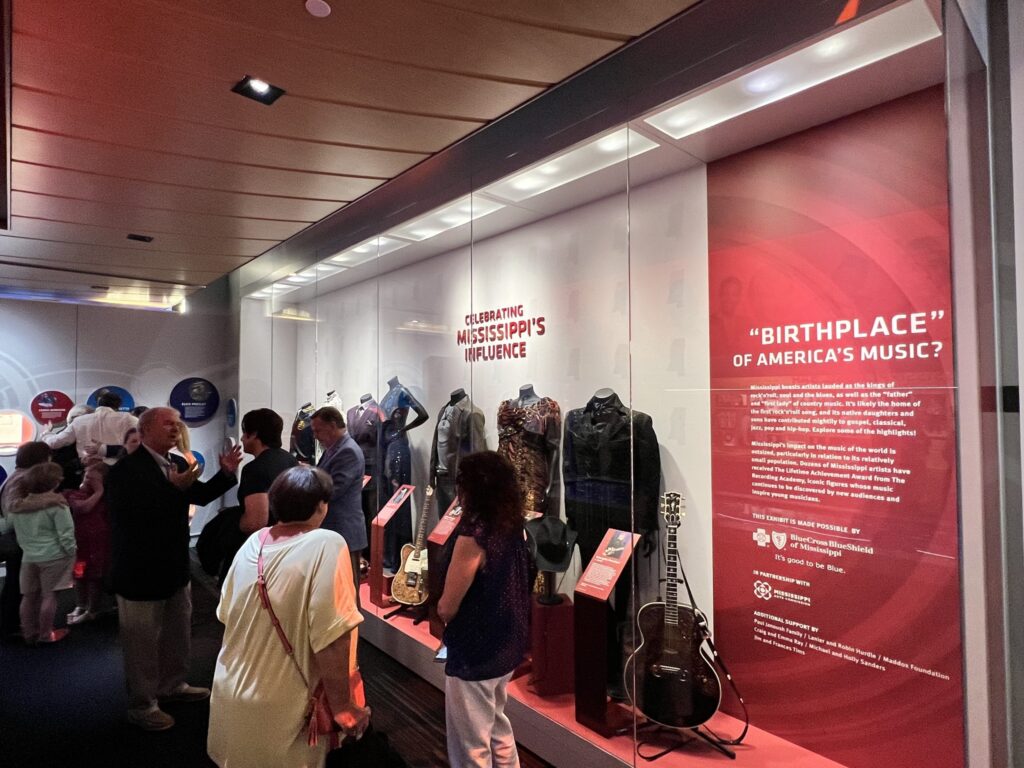 People standing in front of the new Mississippi Legacy Display at the Museum.